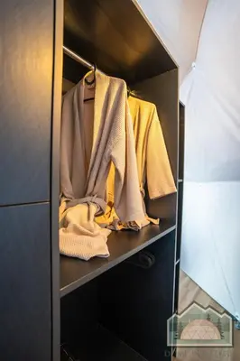 a walk in closet filled with clothes at Dome in Nature in Larnaka