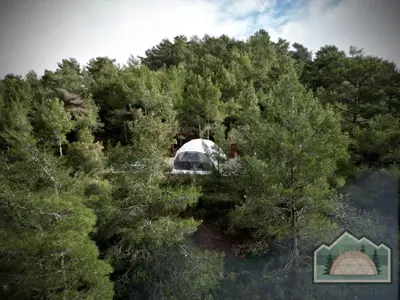 an aerial view of a tent in the woods at Dome in Nature in Larnaka