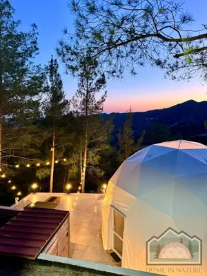 a luxury tent with a view of the mountains at Dome in Nature in Larnaka