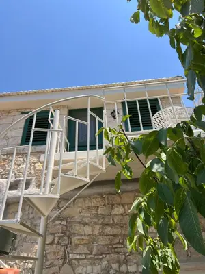 a balcony on the side of a building at The Fig Tree House in Lofou