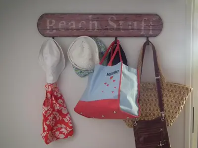 a wall with shoes and bags hanging on a wall at Sunrise Villa in Pervolia