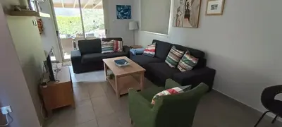 a living room with a couch and chairs and a table at Sunrise Villa in Pervolia
