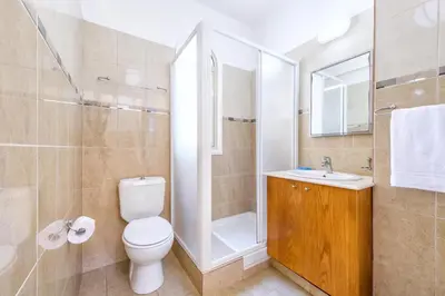 a bathroom with a toilet and a sink and a shower at Alex Villa Kapparis in Protaras