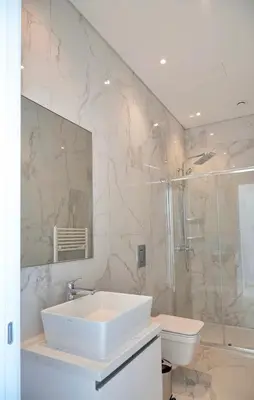 a bathroom with a sink and a shower and a toilet at Sea Pearl Seaview Villa - Oriana in Ayia Napa