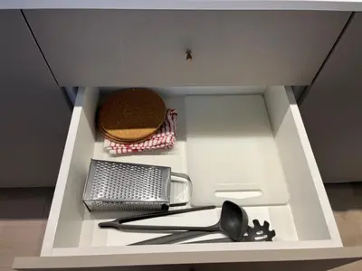 a white drawer with some utensils in it at Modern 2bed in the centre in Nicosia