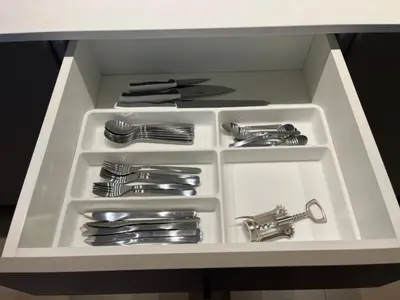 a white drawer filled with dishes and utensils at Modern 2bed in the centre in Nicosia