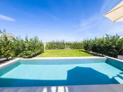 a swimming pool in the backyard of a house at Azure Vista Collection in Protaras