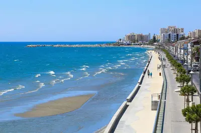 a view of a beach with the ocean and buildings at The Ciao Stelio Deluxe Boutique Hotel - Adults Only in Larnaka