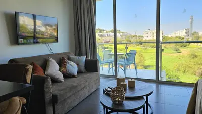 a living room with a couch and a table at STAY White Coral Studio in Protaras