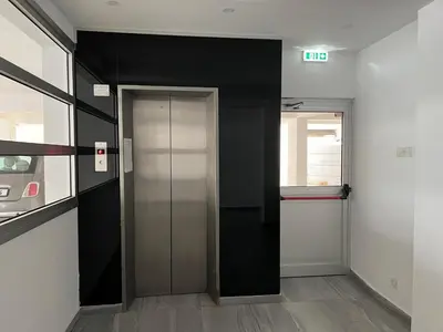 an elevator in an office building with a door at Albert's Apartment Center 202B in Larnaka