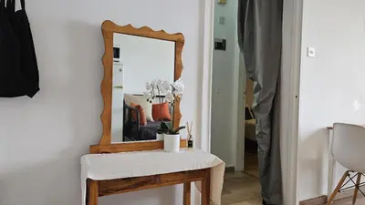 a mirror on a table next to a table with a mirror at STAY Dreamy Seaside Apartment in Larnaka