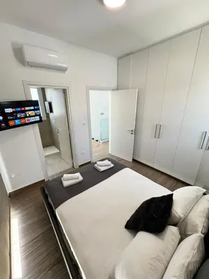 a living room with a large bed and a couch at Protaras Rustic Paradise Luxury Villa 1 in Paralimni