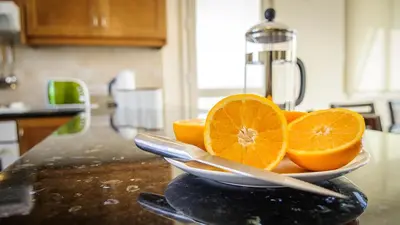 a bowl of orange slices sitting on a kitchen counter at Kapparis Holiday Villa 018 in Protaras