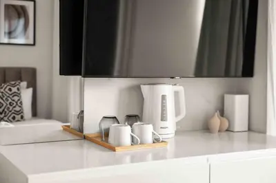 a kitchen counter with a coffee maker on a counter top at Phaedrus Living: Limassol Seaside Residences 01 in Limassol