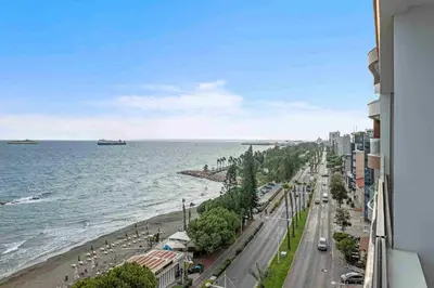 a view of a beach and the ocean from a building at Phaedrus Living: Limassol Seaside Residences 01 in Limassol