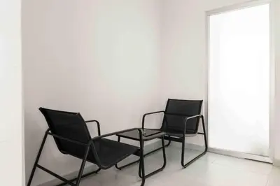 two chairs and a table in a room at Phaedrus Living: Limassol Seaside Residences 03 in Limassol