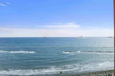 two ships in the ocean on a sunny day at Phaedrus Living: Limassol Seaside Residences 03 in Limassol