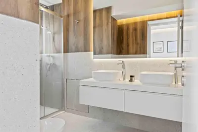 a bathroom with two sinks and a shower at Phaedrus Living Coastal Seaside Residences 04 in Limassol