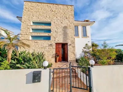 a house with a gate in front of it at Villa Marina in Ayia Thekla with Heated Pool in Ayia Napa