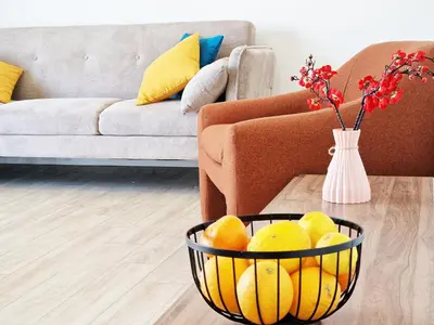 a basket of fruit on a table in a living room at Kitieos Central Apartment with Sea View in Larnaka