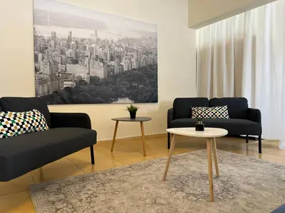 a living room with two couches and a table at STUDIO in Limassol