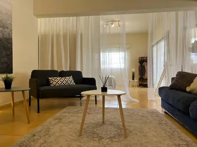 a living room with a couch and a table at STUDIO in Limassol