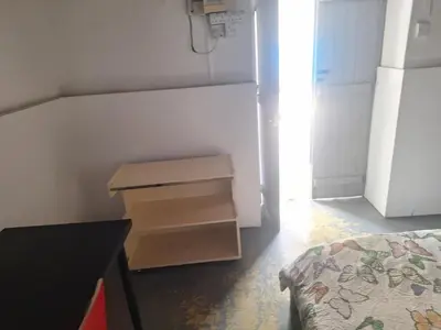a small room with a refrigerator and a drawer at Room with private entrance from outside, traditional house in Livadhia