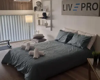 a bedroom with a bed with two stuffed animals on it at LivePro in Larnaka