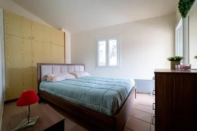a bedroom with a bed and a red lamp at Hubstay Hillside Residence with Private Jacuzzi in Platres