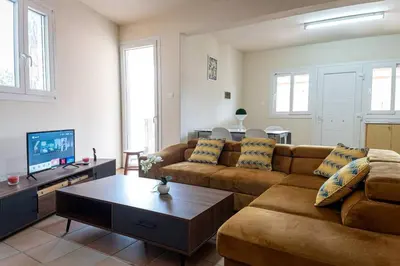 a living room with a couch and a coffee table at Hubstay Hillside Residence with Private Jacuzzi in Platres
