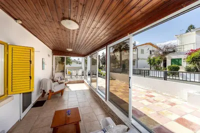 an open living room with sliding glass doors at Ayia Thekla Sea Breeze Villa in Ayia Napa