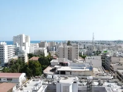 an aerial view of a city with buildings at Aphrodite Heights in Larnaka
