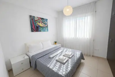 a bedroom with a bed with two towels on it at Villa Dolce Vita in Protaras