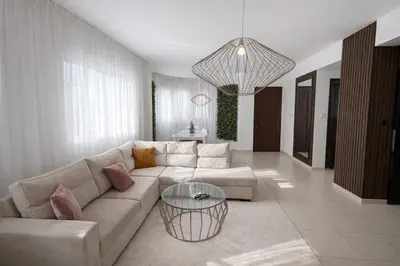 a living room with a couch and a table at Villa Dolce Vita in Protaras