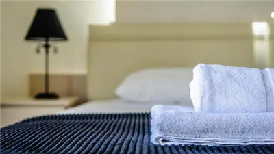 a room with a bed with towels on it at Protaras Holiday Villa 045 in Protaras
