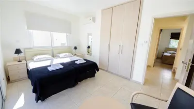 a bedroom with a large bed in a room at Protaras Holiday Villa 045 in Protaras
