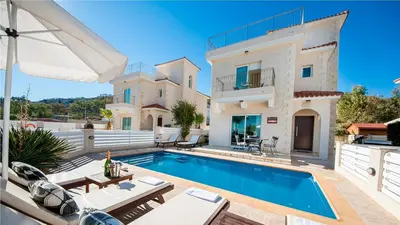 a villa with a swimming pool and a house at Protaras Holiday Villa 045 in Protaras