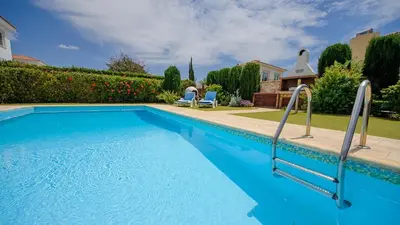 a swimming pool in front of a house at Ayia Napa Holiday Villa 036 in Ayia Napa