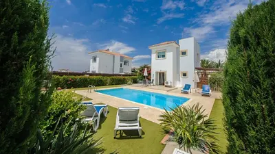 a villa with a swimming pool and a house at Ayia Napa Holiday Villa 036 in Ayia Napa