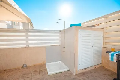 a bathroom with a shower with a white door at Protaras Holiday Villa 035 in Protaras