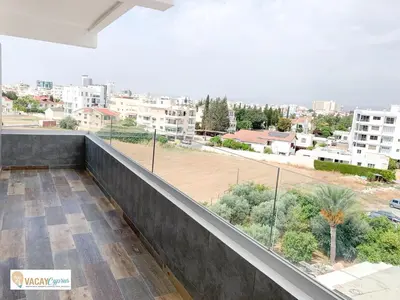 a balcony with a view of a city at Downtown Larnaca Apartment in Larnaka