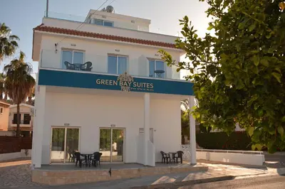 a white building with a sign that reads green easy suites at Green Bay Suites in Protaras