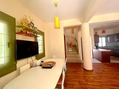 a living room with a tv on the wall at Platform 357 Mimoza Villa with View in Paralimni