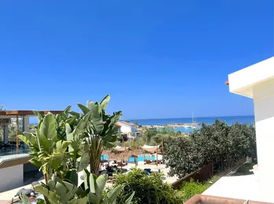 a view of the beach from the balcony of a resort at Platform 357 Mimoza Villa with View in Paralimni