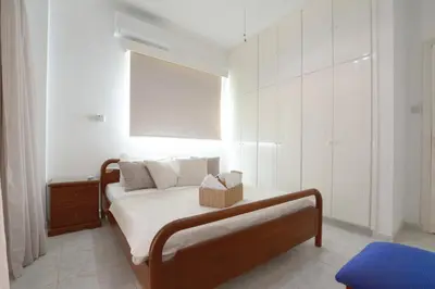 a bedroom with a bed with a basket on it at Villa Chloe in Ayia Napa