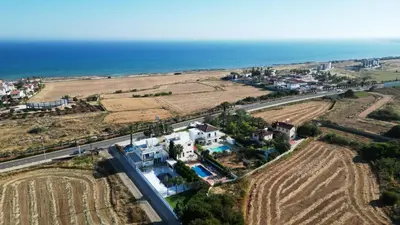 an aerial view of a house next to the ocean at Villa Chloe in Ayia Napa