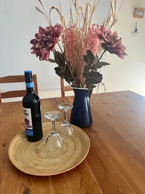 a bottle of wine and two wine glasses on a table at Villa Calm 100m from the beach in Ayia Napa