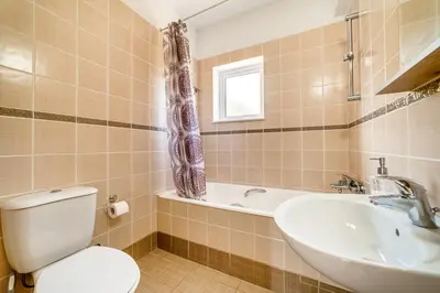 a bathroom with a toilet and a sink and a tub at Sunrise Experience in Ayia Napa