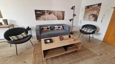 a living room with two chairs and a coffee table at City Center Apartment 2 in Nicosia