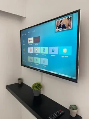 a flat screen tv hanging on a wall at Top floor Flat in Nicosia 2 in Nicosia
